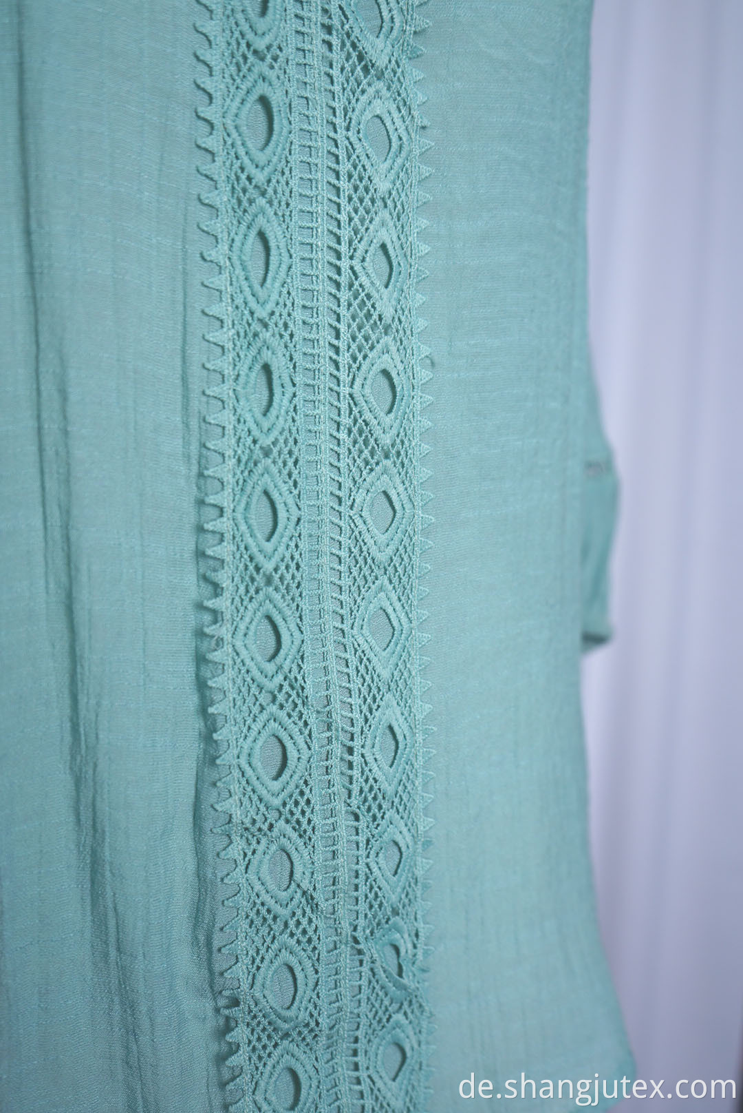 garment have lace trimmings of top